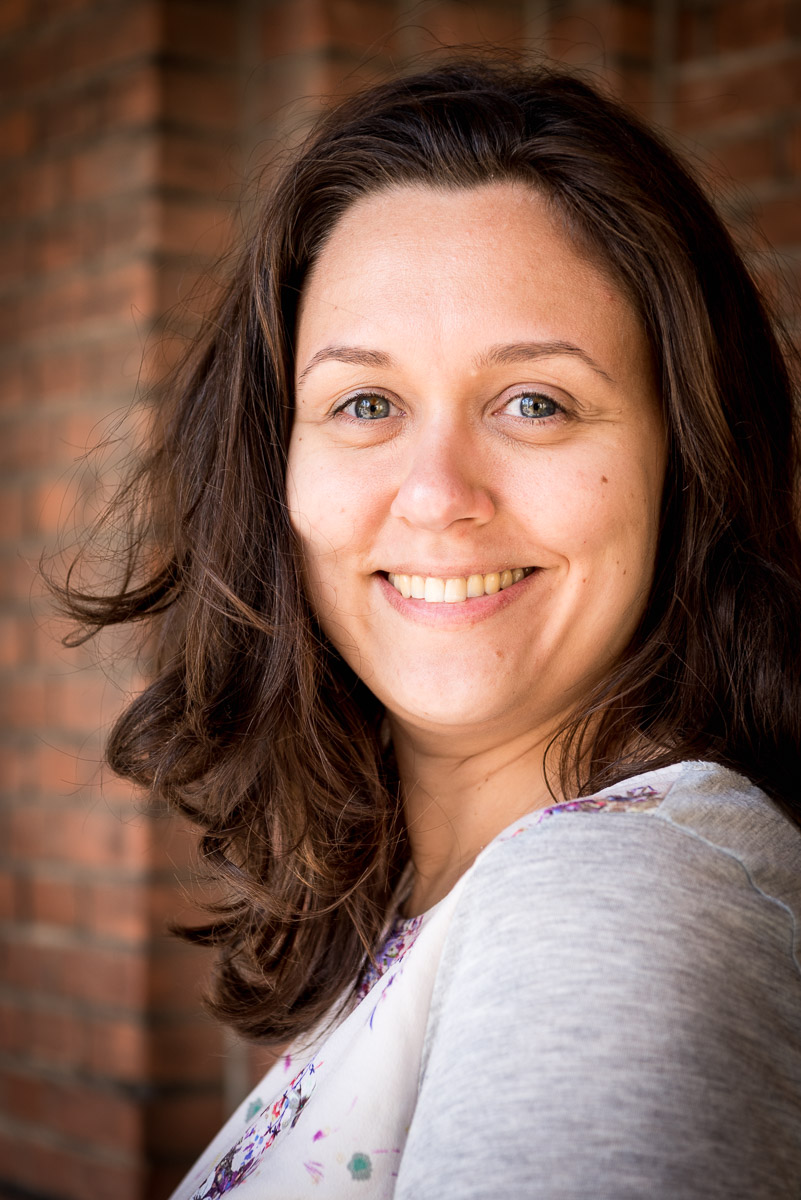 Foto van Kim, lachend naar de camera